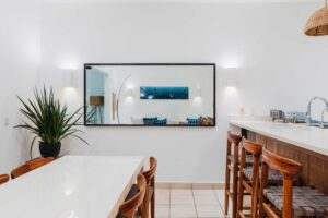 Solar Townhouse Hacienda Iguana - 2 Bed 2 Bath w/ Pool - Featured Image showing dining table and kitchen bar